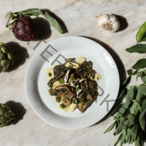 Slow Roasted Baby Artichokes with Fava Beans, Greens, Garlic, and Parmigiano-Reggiano